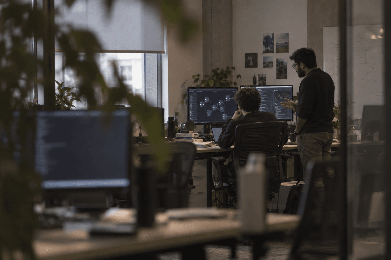 The team working through a build in the Standby Labs office, seen through the plants